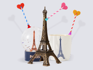 A miniature Eiffel Tower and a snow globe